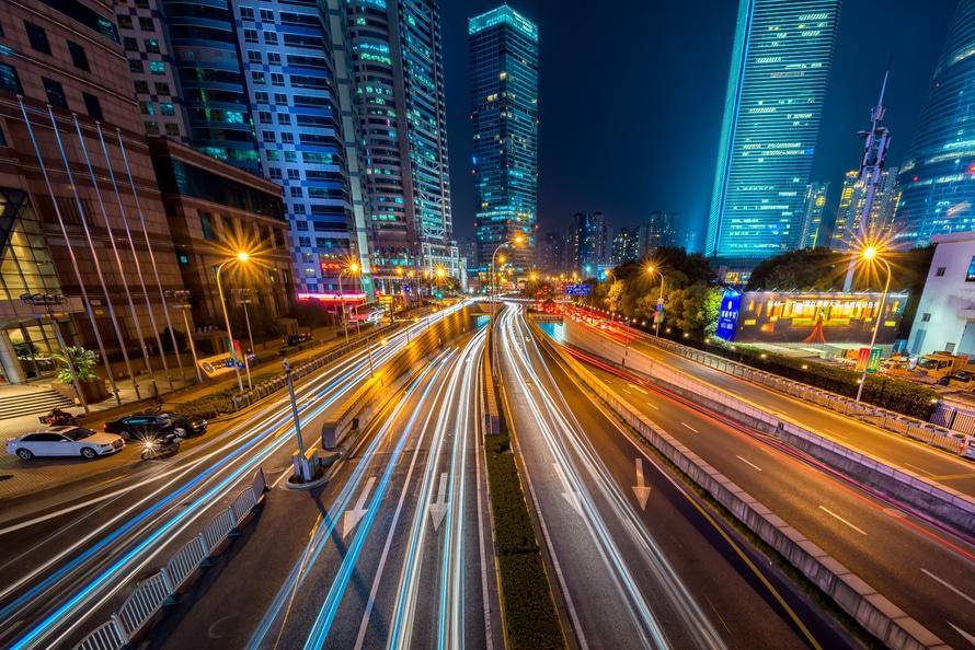 Timelapse cars moving with hotels in the background gecko hospitality
